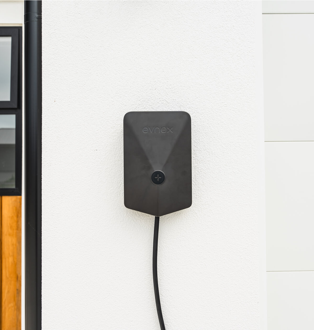 Evnex home EV charger mounted on a wall
